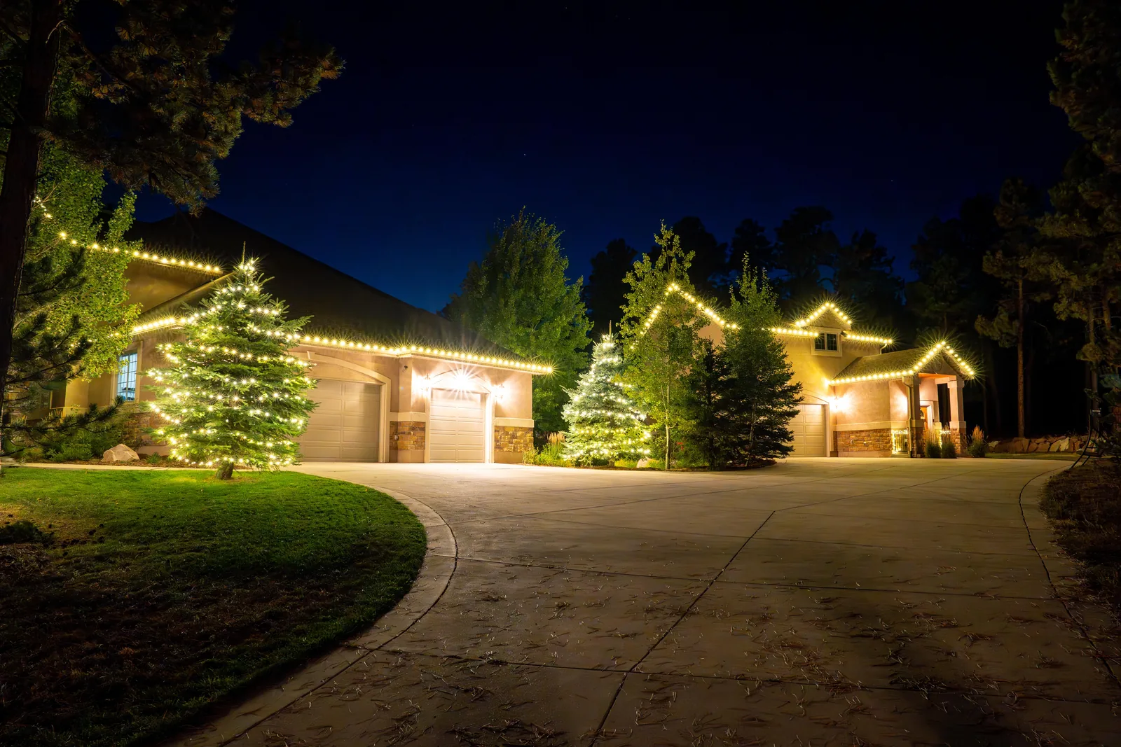 Warm white lights illuminating a home exterior